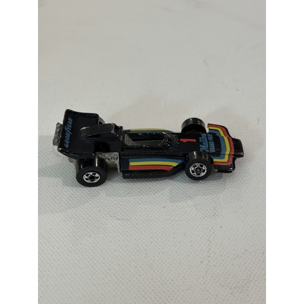 1982 Hot Wheels Malibu Grand Prix 1973 Malaysia Blackwalls Metal Base Black #1